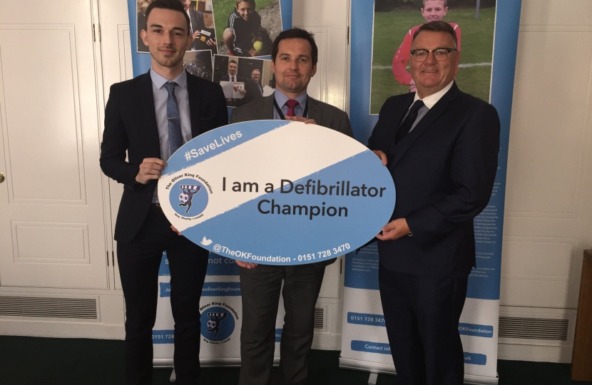 Chris Green, MP for Bolton West, with Jake Morrison, Chief Executive of The Oliver King Foundation, and Mark King, father of Oliver King