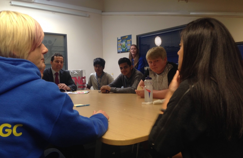 Chris sat at table with local youth group