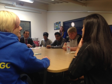 Chris sat at table with local youth group