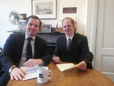 Photo attached of (left to right) Chris Green MP and James Grundy MP signing the joint letter 