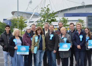 Chris & team outside the Macron Stadium